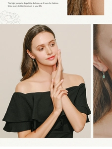 Detail of s925 silver hoop earrings featuring rectangular green tourmaline pendants