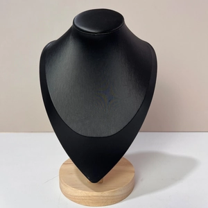 Detail of matte black necklace display bust with round solid beech wood base