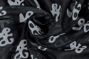 Macro shot of breathable mesh fabric featuring abstract octopus print on a bodysuit