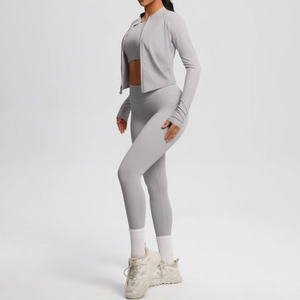 Detail of light gray three-piece yoga set showing brushed texture and high elasticity fabric