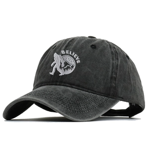 Distressed dark grey baseball cap with BELIEVE embroidery and Bigfoot mountain design