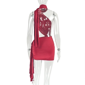 Detailed back view of a red asymmetric backless mini dress with ruched drawstring details