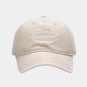 Detail of Moormoor embroidery on light beige vintage washed cotton baseball cap
