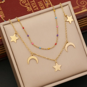 Detail of double-layer gold necklace with colorful beads, stars, and moon pendants