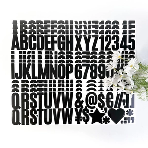 Detail of 2.5-inch black glossy alphabet and number stickers with decorative daisy