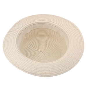 Interior detail of a beige woven straw sun hat showing breathable texture and sweatband