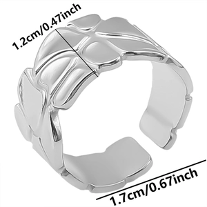 Close-up of adjustable stainless steel ring with 1.2cm width and embossed floral texture