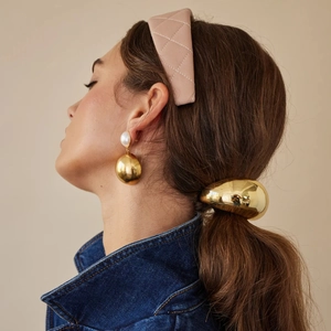 Chic ponytail holder and quilted pink hairband set styled on model in denim jacket