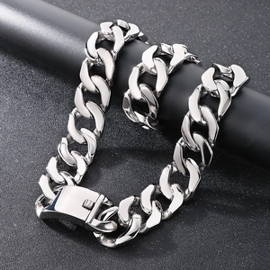 Detailed close-up of polished silver stainless steel Cuban link chain with a secure clasp