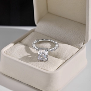 Close-up of S925 sterling silver ring hallmark and radiant cut zircon in a jewelry box