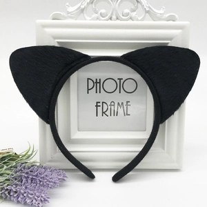 Close-up of black plush cat ear headband made of faux fur for cosplay parties