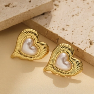 Baroque heart pearl stud earrings with textured gold metal frame for a vintage look