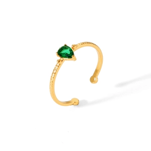 Detailed macro view of 18k gold plated ring with green teardrop zircon and hammered texture