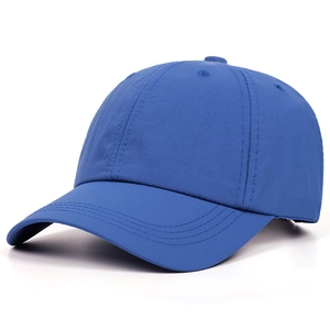 Close-up of royal blue baseball cap detailing six-panel structure and breathable eyelets