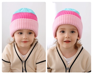 Detailed close-up of colorful striped knit beanie with rib knit texture and soft yarn