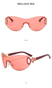 Detail view showing frameless Y2K sunglasses with red lenses and golden ring hinges