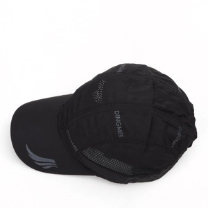 Close-up of black breathable mesh vents and quick-dry fabric on outdoor baseball cap