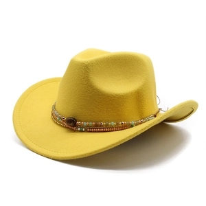 Detail of yellow wool felt cowboy hat featuring ethnic beaded band and teardrop crown
