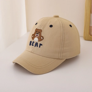 Detail of khaki cotton baseball cap featuring brown cartoon bear embroidery and blue BEAR text