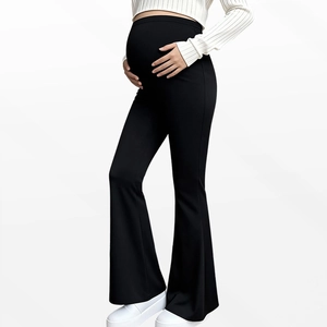 Side view of black maternity flare leggings showing high waist belly support design