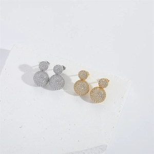 Minimalist gold and silver double ball stud earrings with cubic zirconia on stone pedestal