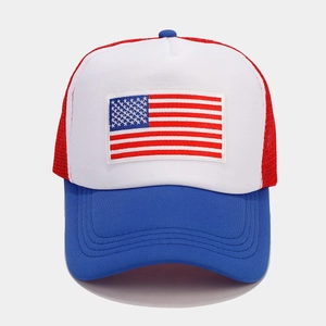Detail of red mesh trucker hat with US flag embroidery patch and blue contrast brim