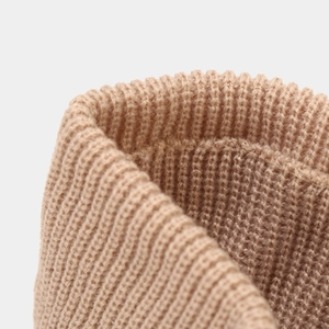 Close-up of khaki ribbed knitted headband showing soft texture and elastic weave