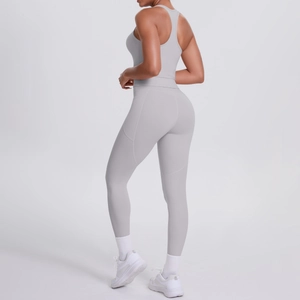 Detail view of high-waist yoga leggings back seam and light grey brushed stretch fabric