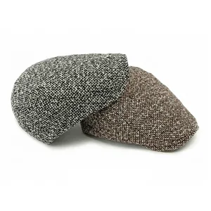 Classic tweed newsboy caps in grey and brown wool blend with vintage texture