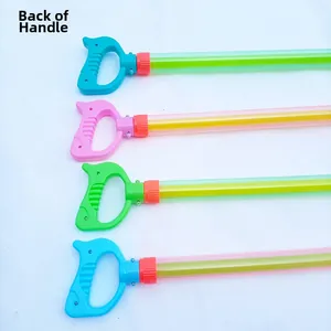 Detail of four colorful plastic water gun handles showing the piston pump back mechanism