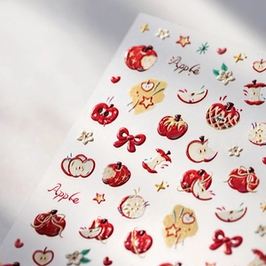 Stickers ongles 3D relief avec pommes rouges et nœuds, vue en angle de 45 degrés