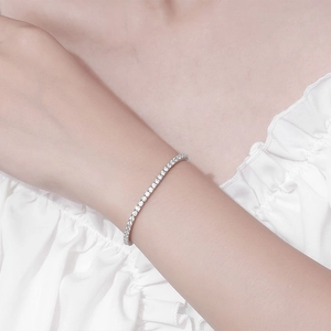 Elegant 925 silver tennis bracelet with 2.5mm moissanite stones worn on a female wrist