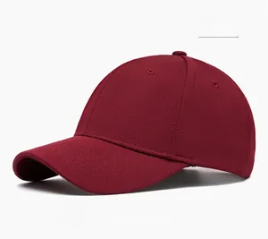 Detail view of burgundy baseball cap with fabric texture and stitching details