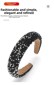 Detail of handmade wide headband with black crystals and white pearls on beige lining