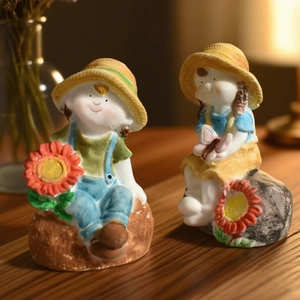 Detailed close-up of boy and girl figurines with straw hats and sunflower for DIY molds