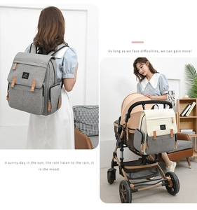 Oxford fabric diaper backpack shown in gray and beige being used on a stroller