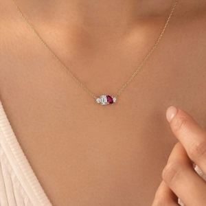 Elegant gold necklace with geometric multi-gemstone pendant and water drop zircon design