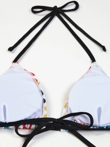 Detail of floral geometric bikini top with removable pads and black adjustable neck ties