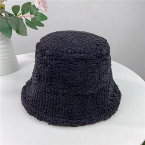 Close-up of the dense lambwool texture and plush material on this black bucket hat