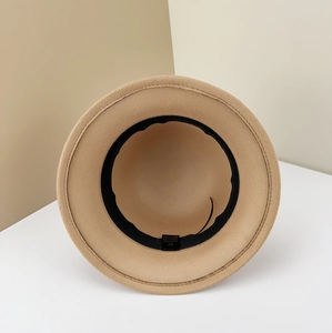 Interior view of wool-style fedora showing adjustable sweatband and care label
