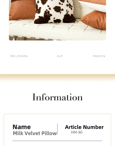 Detail of soft milk velvet cow print and brown leather pillow covers on a white sofa