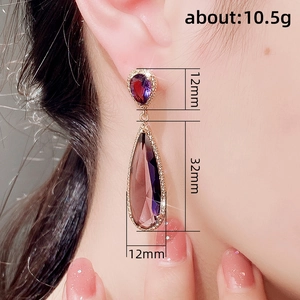 Vintage gold-plated drop earrings featuring deep purple rhinestones for formal occasions