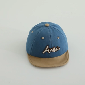 Detailed close-up of Angel embroidered lettering on baby cotton baseball cap with air vents