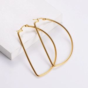 Minimalist 18k gold plated D-shape geometric hoop earrings on a white stone base
