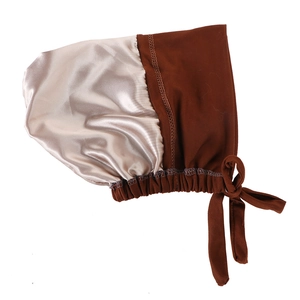 Detail of satin hair bonnet with champagne gold surface and brown adjustable drawstring ties