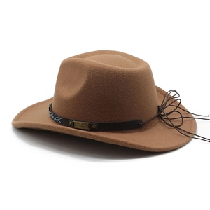 Detail of western fedora hat featuring a leather band with metal studs and blue stitching