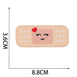 Detail view of heart and smiley band-aid patch with 3.6cm x 8.8cm dimensions