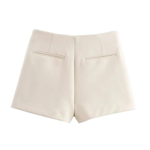 Detail view of high waist shorts in cream white with back welt pocket design