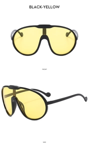 Detail view of large frame cycling sunglasses in black and yellow from front and side