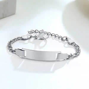 Macro detail of polished stainless steel ID bracelet with blank engravable metal plate